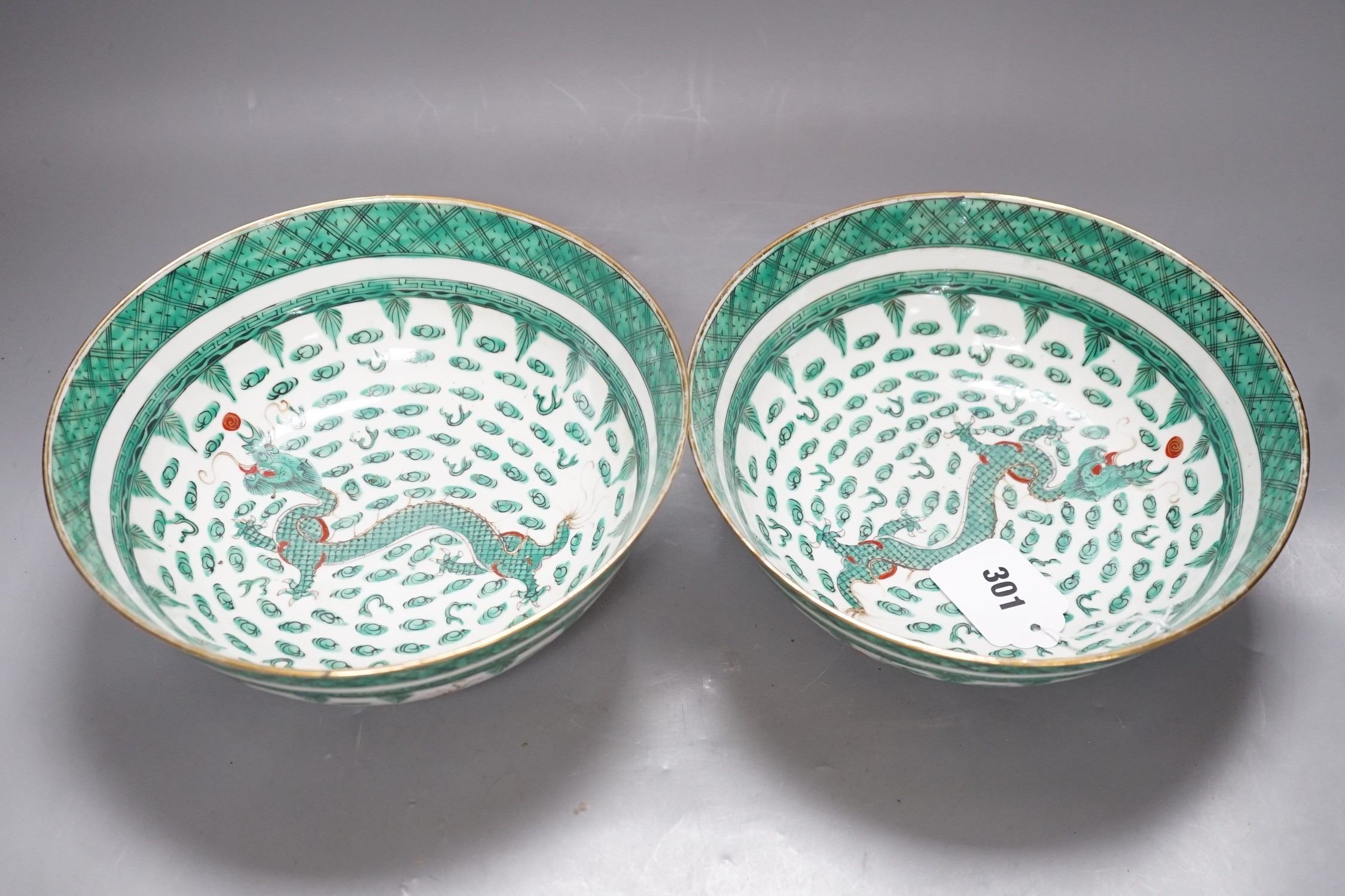 A pair of Chinese green enamelled ‘dragon’ bowls, 20th century, 23cm diameter